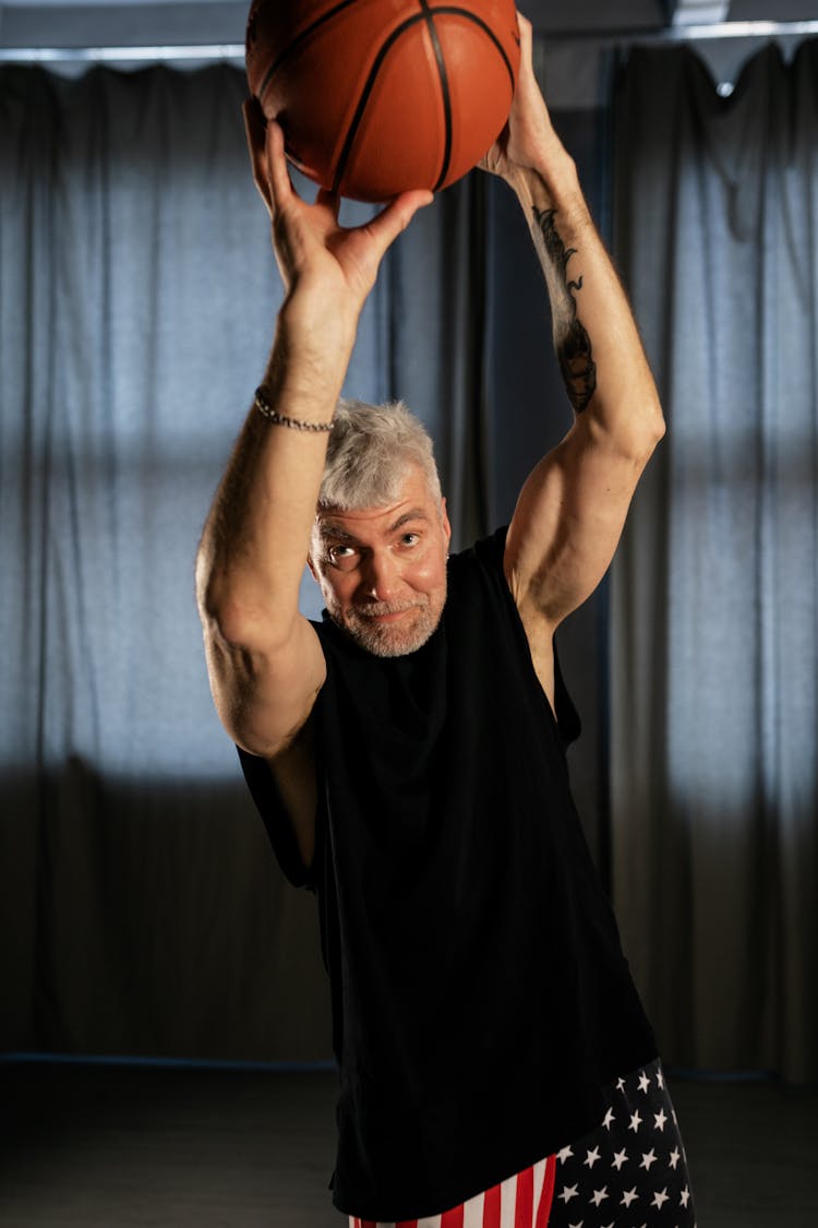 Elderly Man Shooting A Basketball