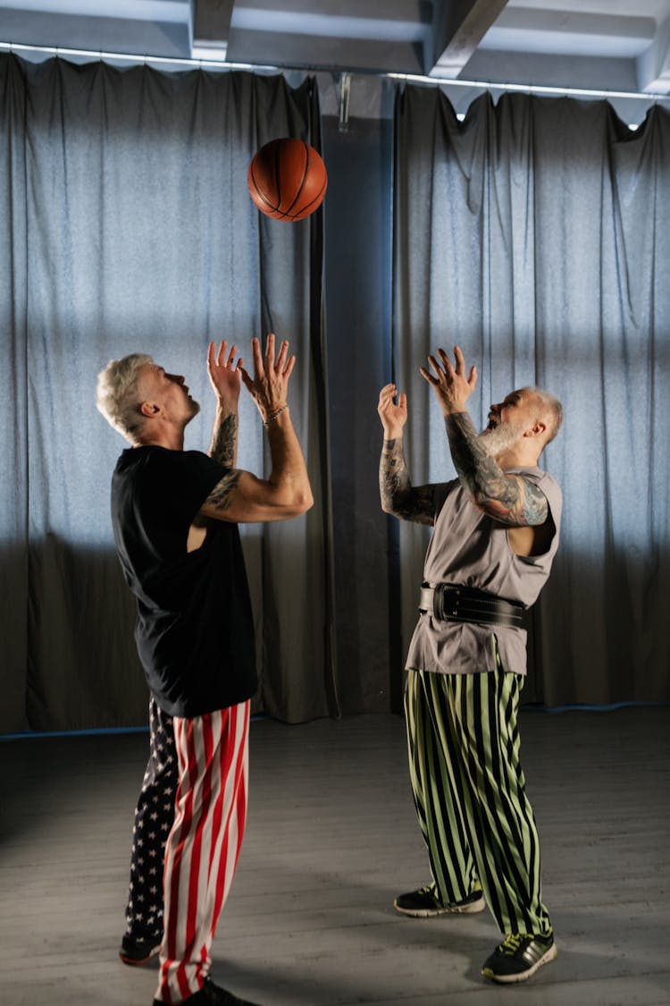 Elderly Men Playing Basketball