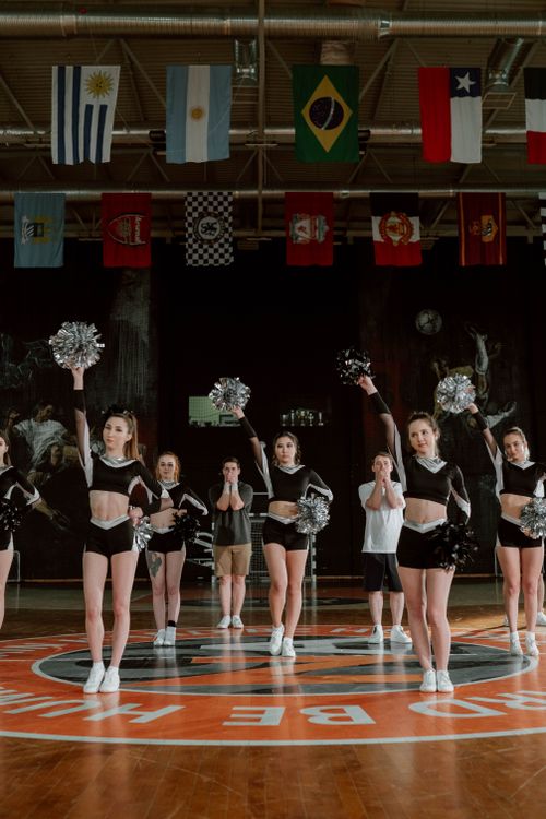 Cheering Commando Cheering Squad Dancing at the Court · Free Stock Photo