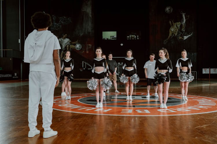 A Cheering Squad Practicing In A Court