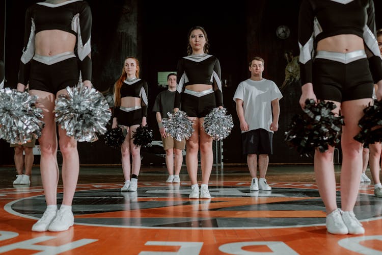 Cheering Team Practicing In The Gym