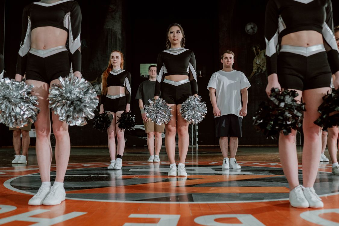 Cheering Team Practicing in the Gym · Free Stock Photo