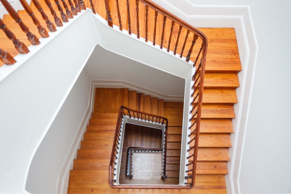 Aerial view of a spiral wooden staircase with railings in Porto, Portugal.