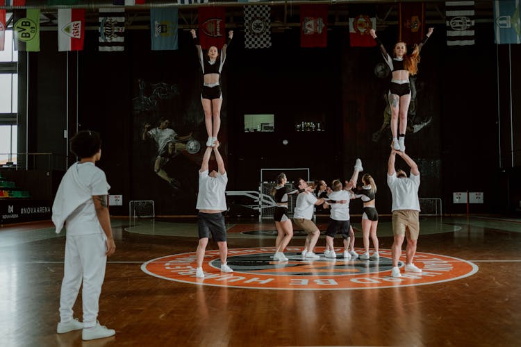 Cheerleaders Performing At The Gym