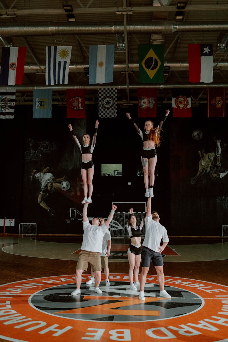 Cheerleaders Performing At The Gym