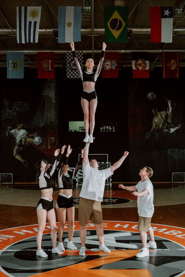 Cheerleaders Performing At The Gym