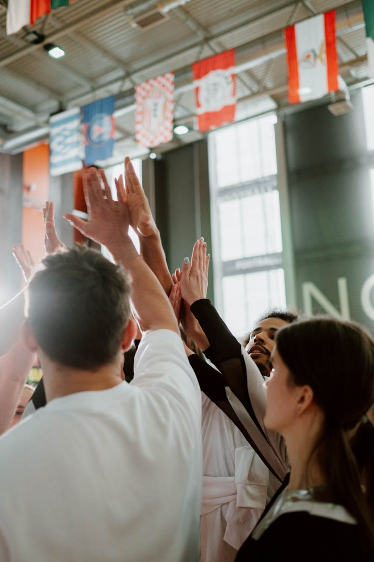 Team Raising Their Hands