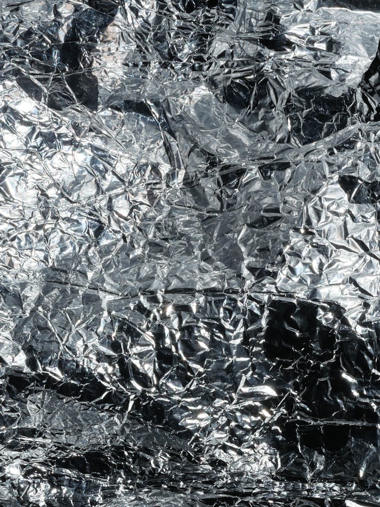 Close-up Of A Creased Tin Foil 