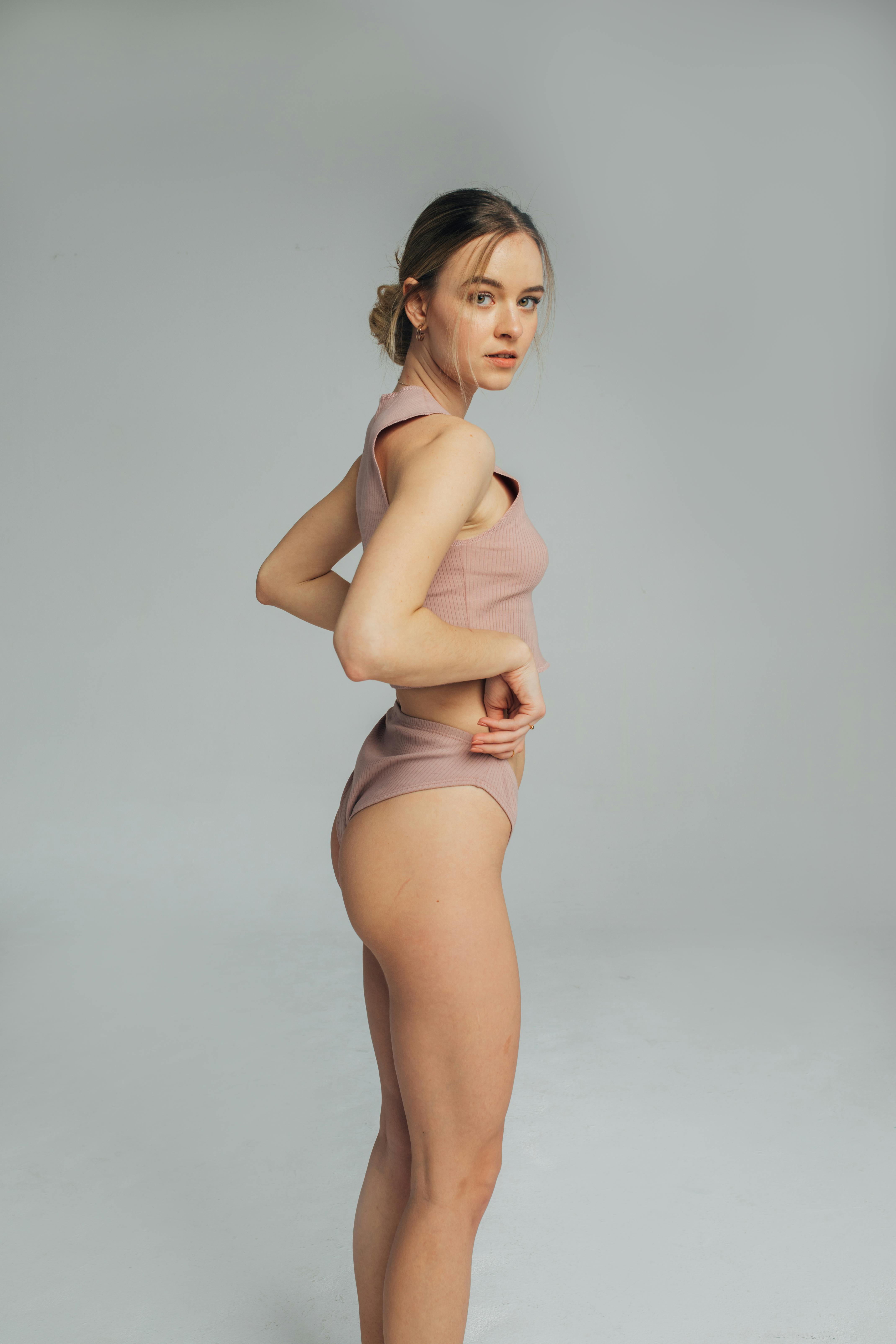 Woman In Corrective Panties, Female Body In Shapewear On Purple Background,  Studio Shot Stock Photo, Picture and Royalty Free Image. Image 155752485.