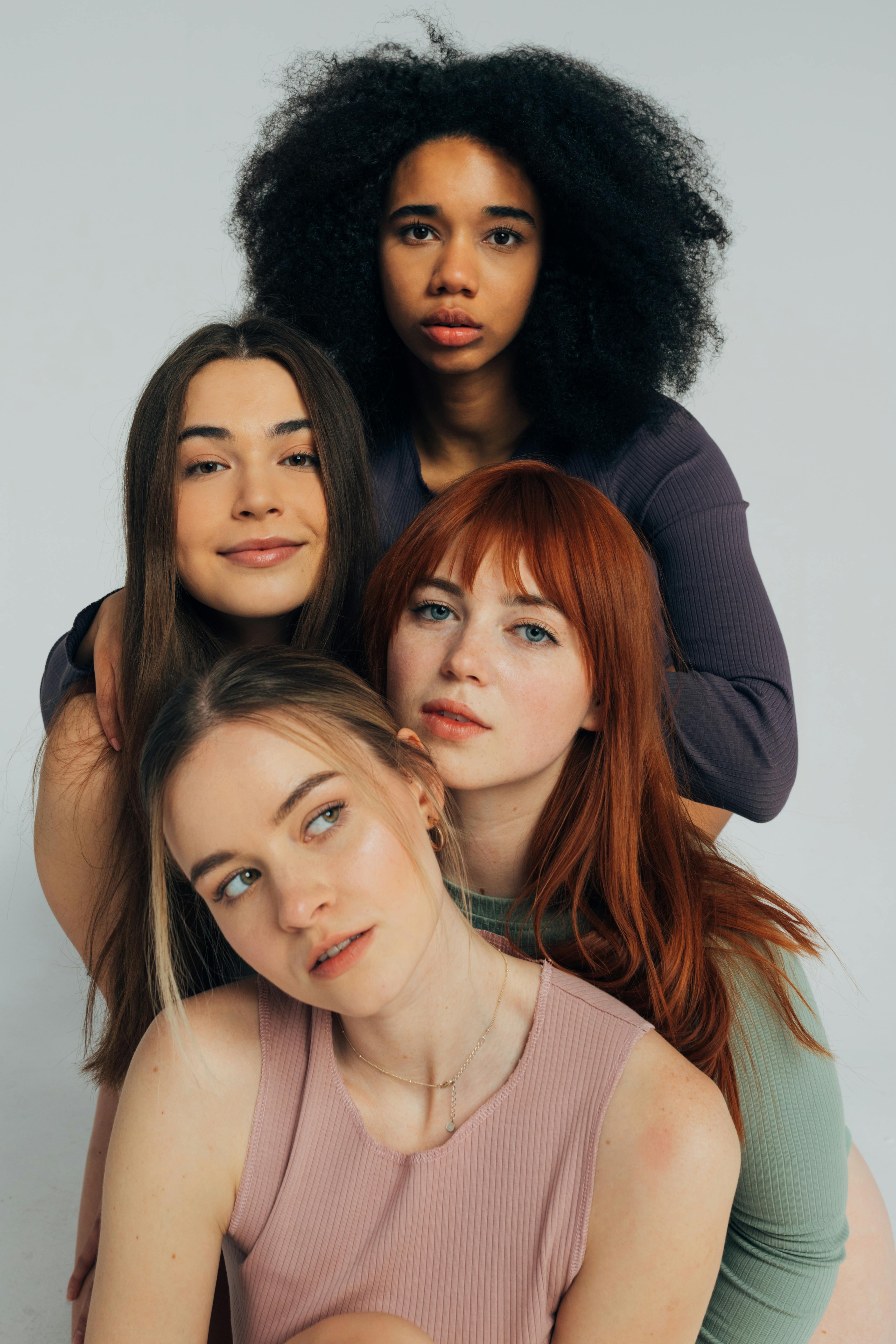 a group of women standing behind on another