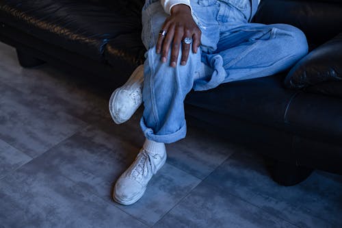 Free A Person Sitting on a Sofa Stock Photo