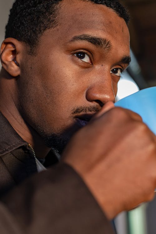 Close up of a Man Drinking Coffee