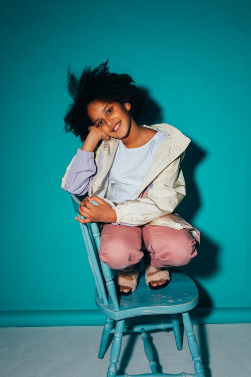 Girl Sitting on a Chair