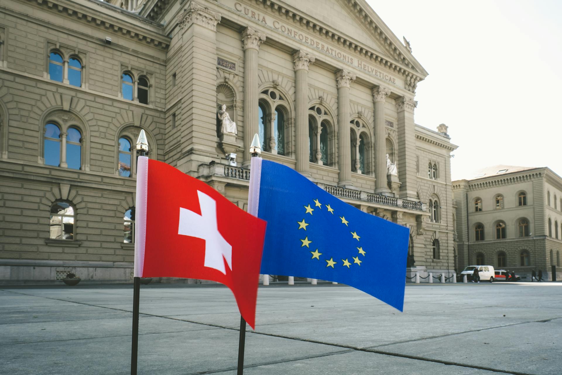 The Switzerland and Europian Flags Near the   Court of Swiss Confederation in Bern, Switzerland