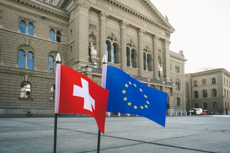 The Switzerland And Europian Flags Near The   Court Of Swiss Confederation In Bern, Switzerland