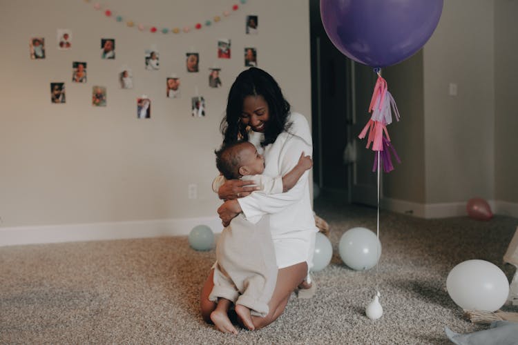 Woman Hugging A Toddler