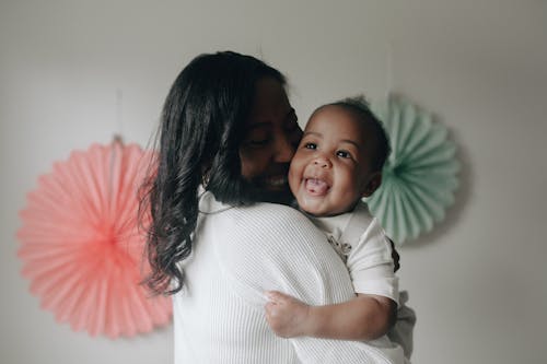 A Woman Carrying her Child