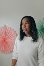 Woman in White Turtleneck Sweater Holding Red Umbrella