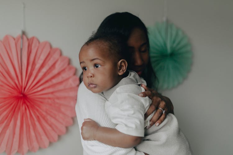 Mother Holding Baby In Hands