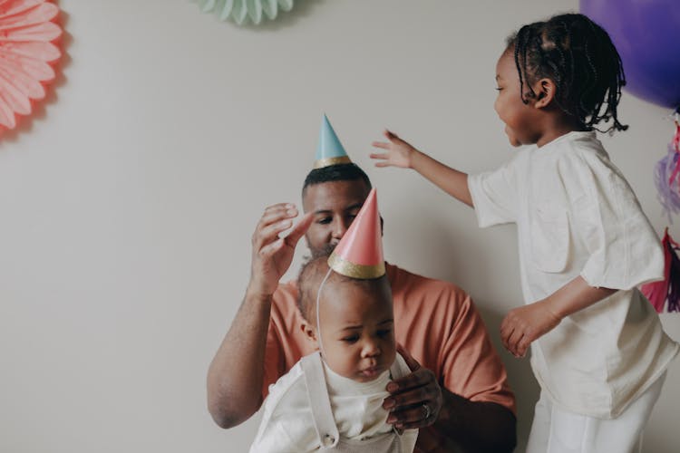 Toddler Wearing A Party Hat