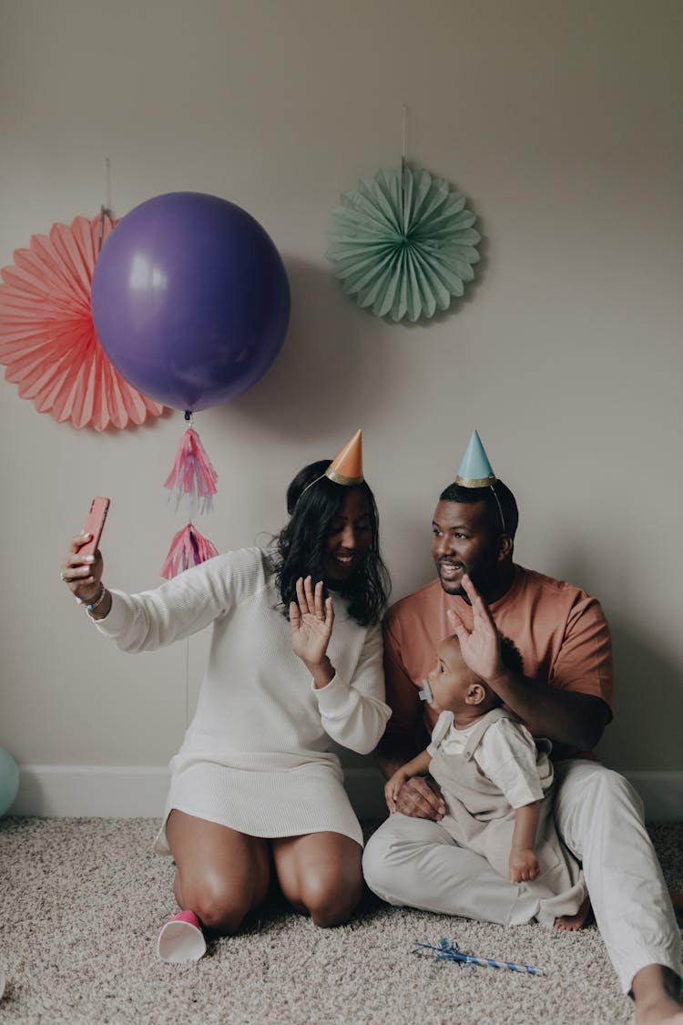 Mother Daughter And A Baby Celebrating Birthday At Home 