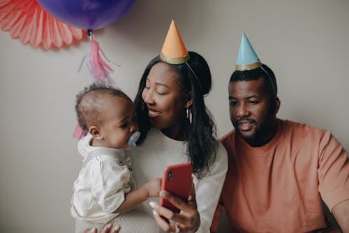 Free Family Celebrating a Childs Birthday  Stock Photo