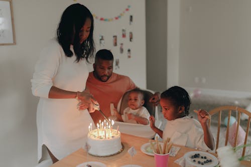 Free Family with Two Kids Celebrating Birthday at Home  Stock Photo
