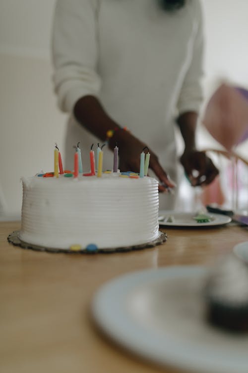 Free Shallow Focus of a Birthday Cake on Wooden Surface Stock Photo