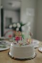White Round Cake With Candles on Top