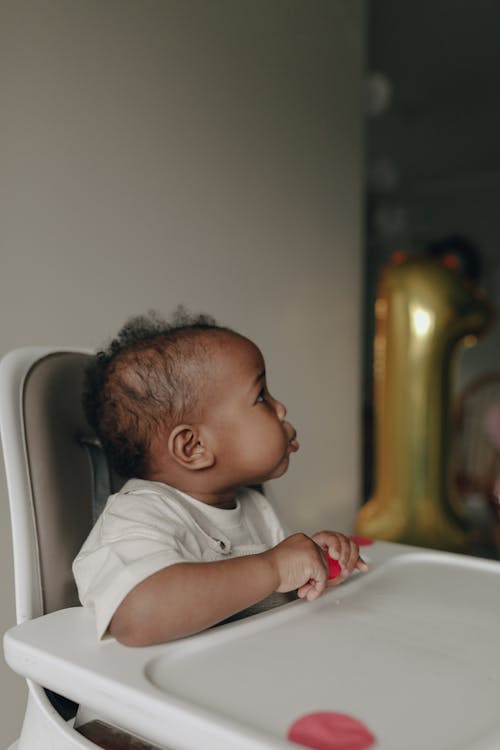 Free Child in Feeding Chair Stock Photo