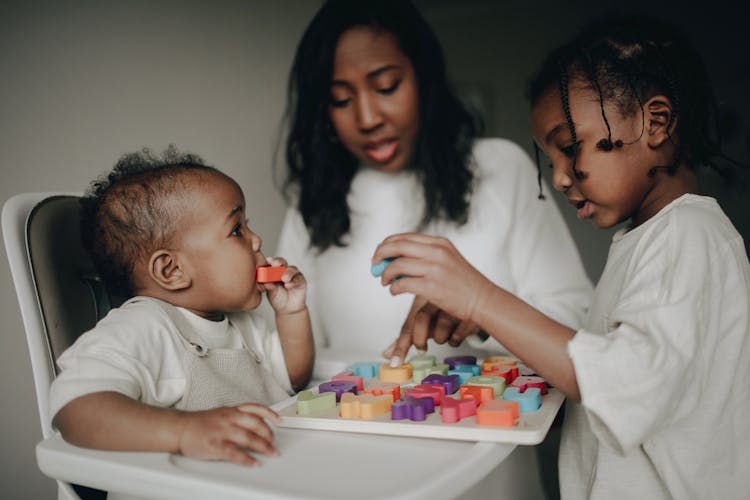 Family Playing With Toy Letters