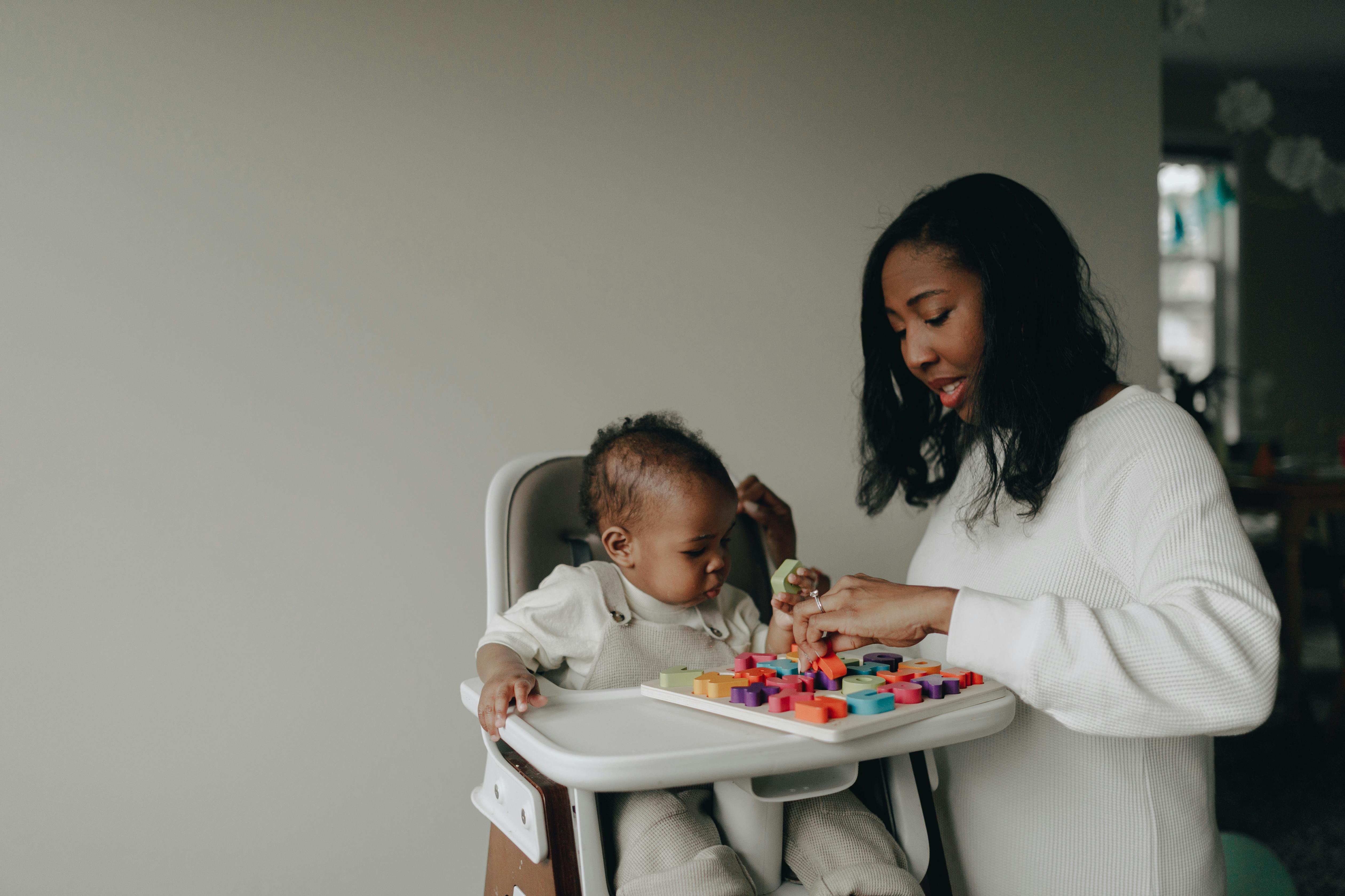 woman playing with the baby