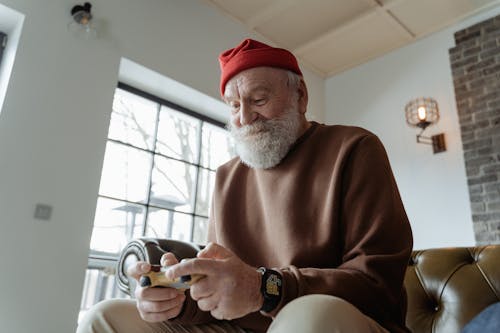 Man in Brown Sweater Playing