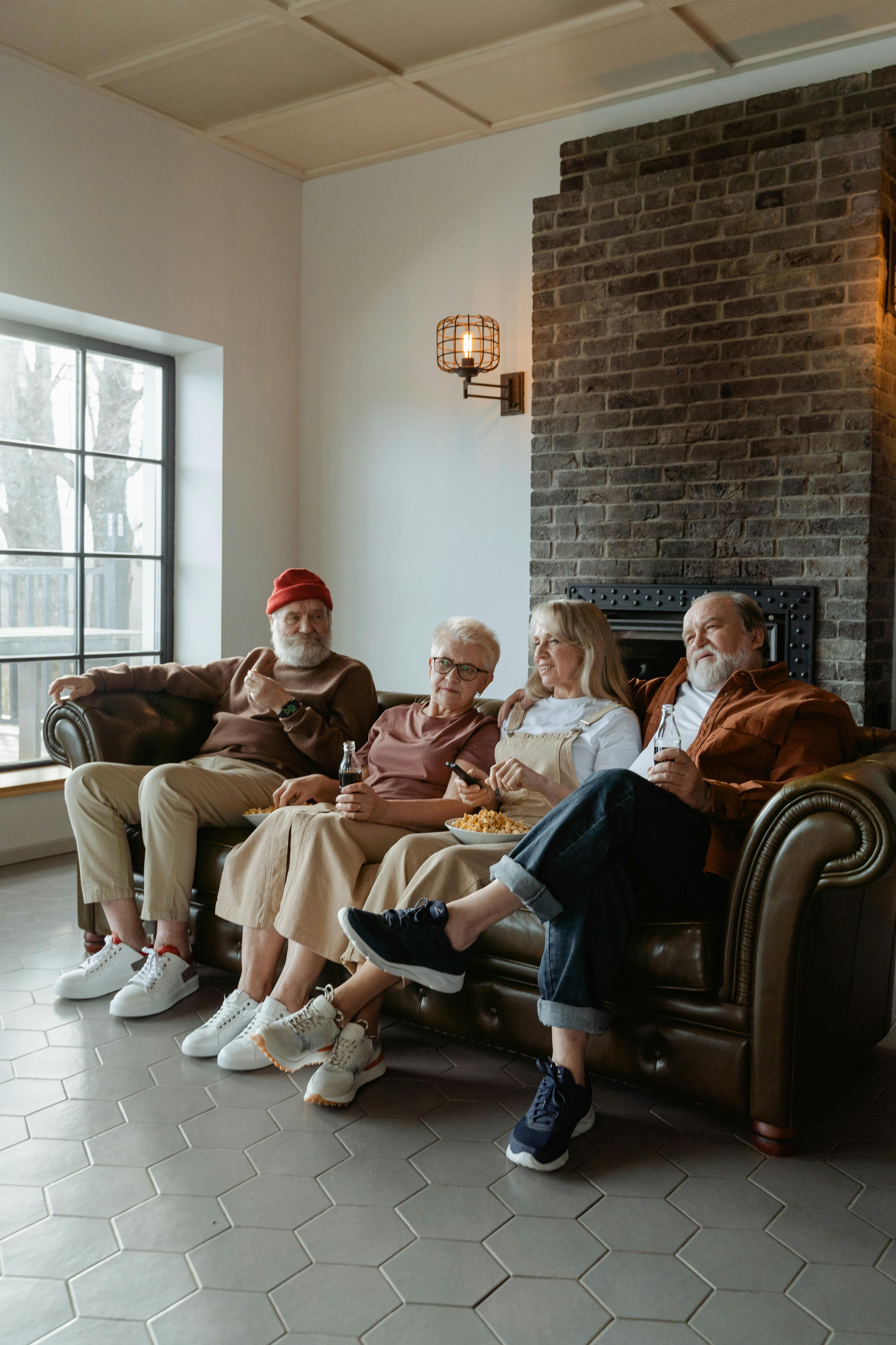 people sitting on a leather couch