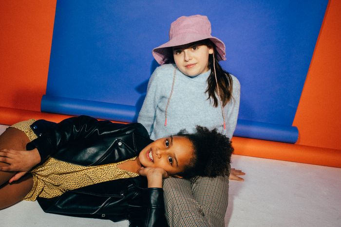 Two children in colourful studio outfits — photo by KoolShooters on Pexels