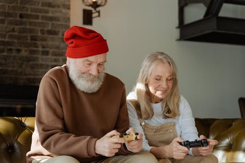 Free Man and Woman Playing Video Games Stock Photo