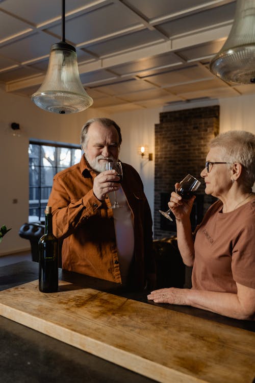 Free Man in Brown Button Up Shirt Drinking Wine Stock Photo