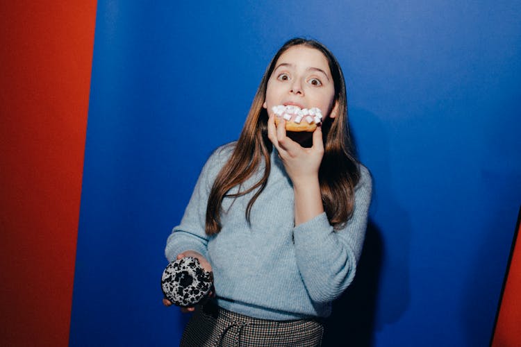 Girl Eating A Doughnut