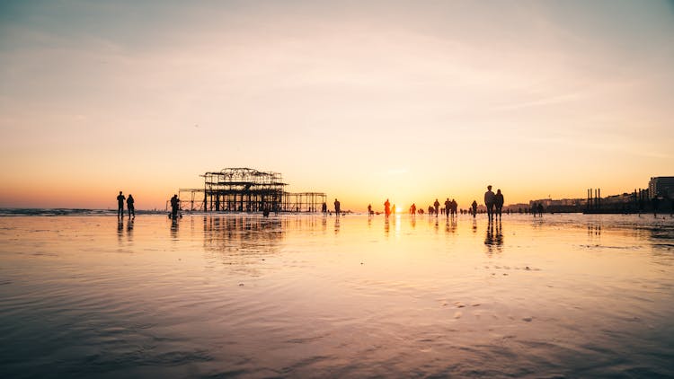 People On Beach During Sunset