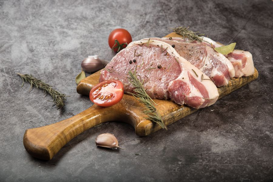 Fresh pork cuts on a board