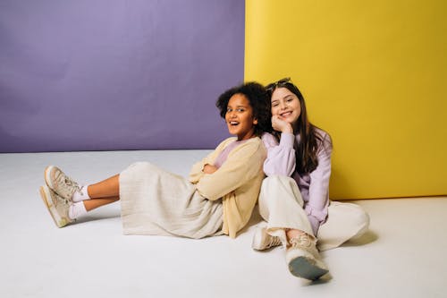 Girls Sitting on the Floor Smiling