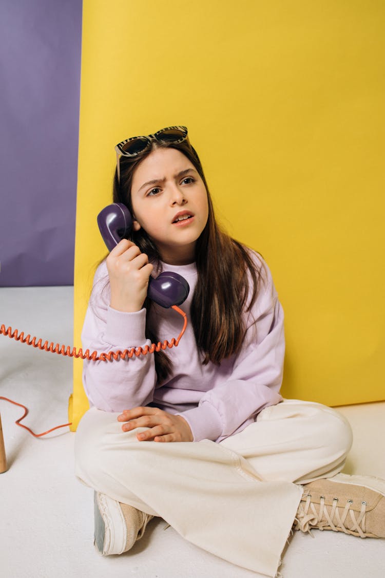 Girl Holding A Telephone