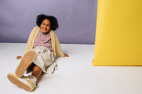 Fashionable Girl Sitting on the Floor