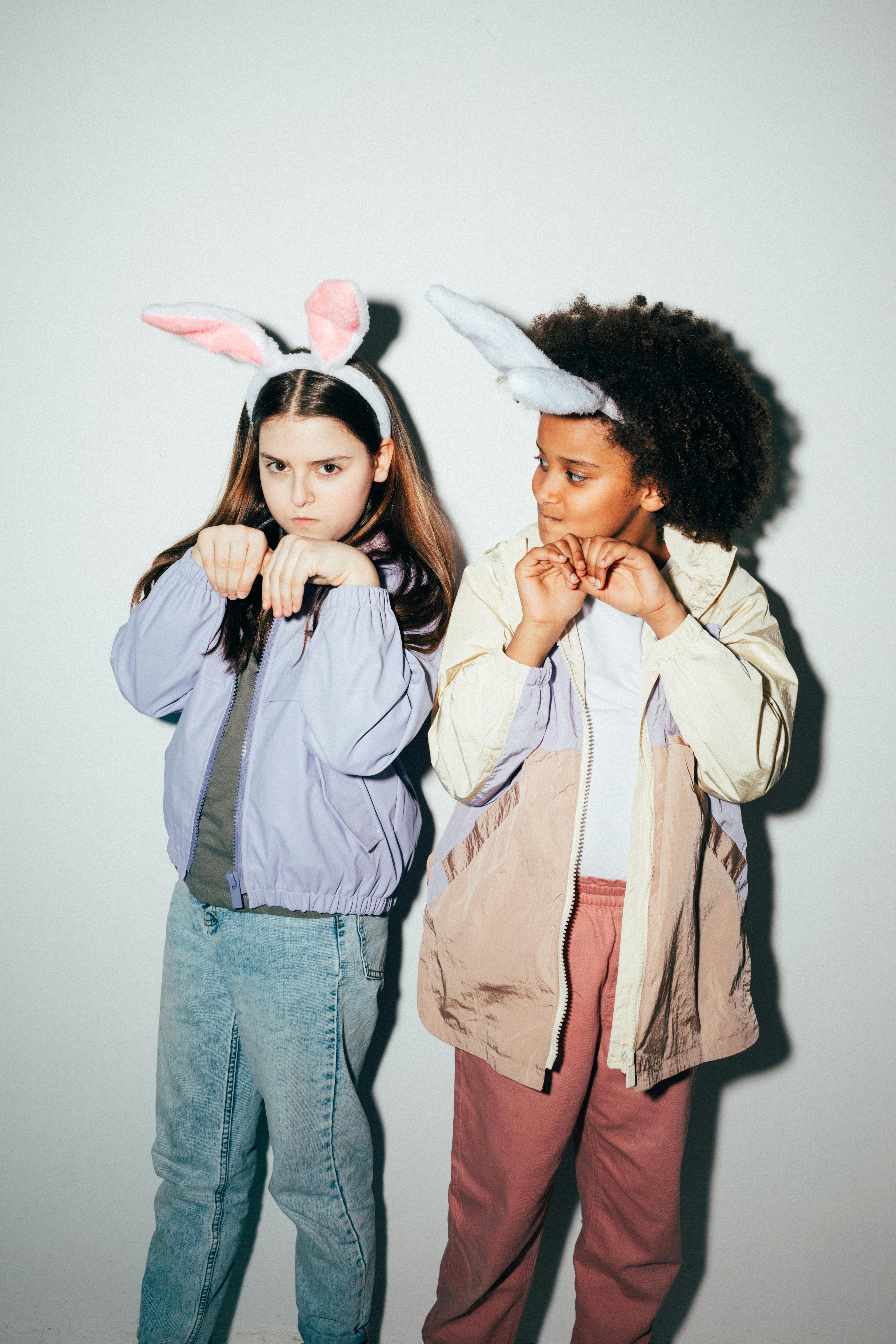 girls wearing rabbit ears posing together