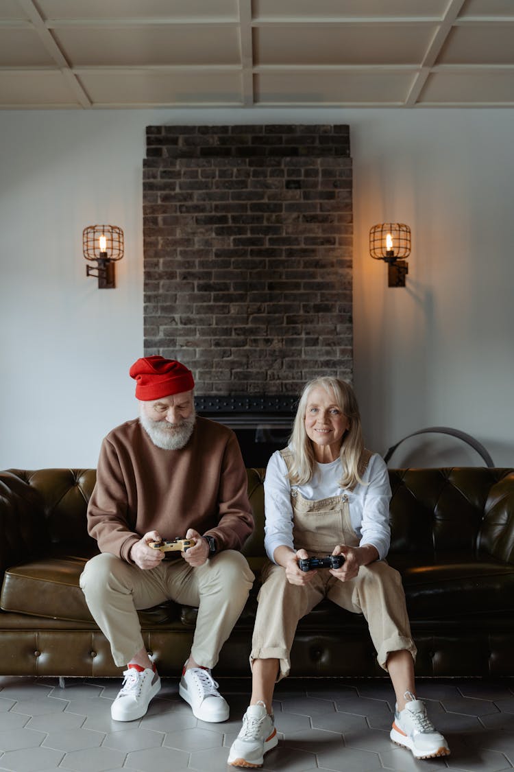 Man And Woman Sitting On A Sofa