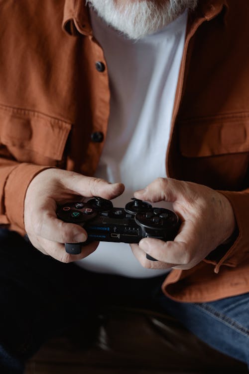 Person Holding Black Controller