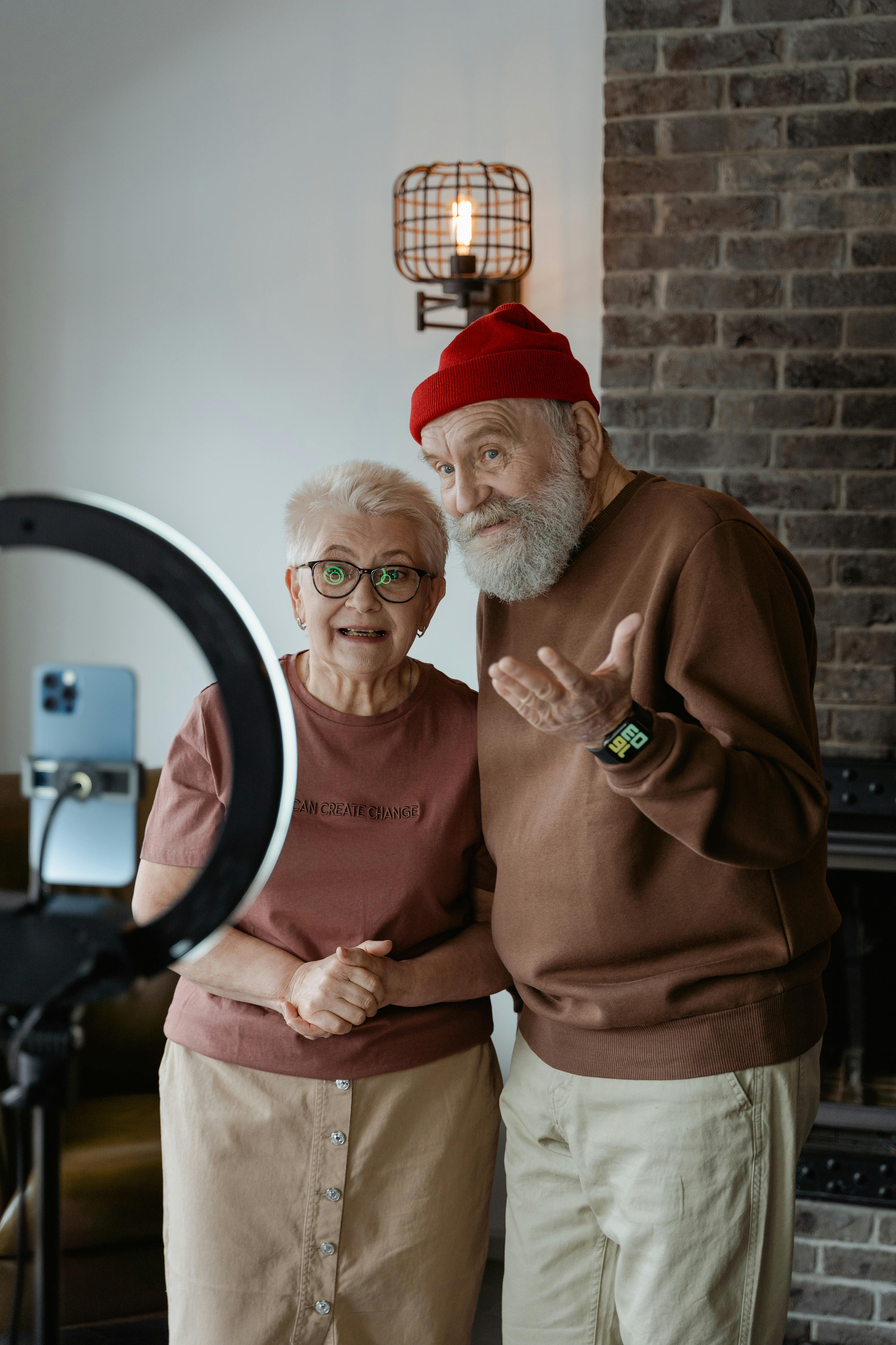 man in brown sweater standing beside woman in brown shirt