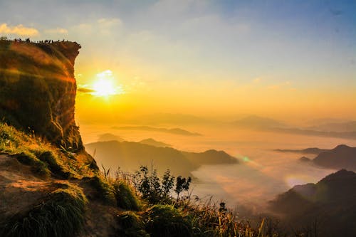 Free Aerial Photo of Mountain Surrounded by Fog Stock Photo