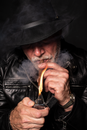 Man in Black Leather Jacket Smoking Cigarette