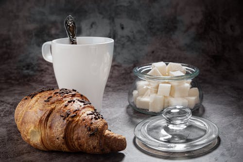 
A Close-Up Shot of a Croissant and a Cup of Coffee